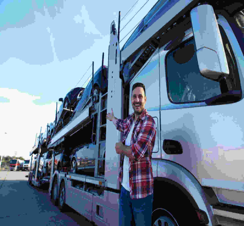 Multi-car auto transport trailer loading sedans for cross-country shipping